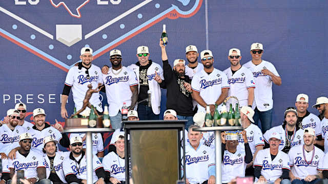 The Texas Rangers pose for a photo during the celebration outside of the ballpark after the World Series championship parade at Globe Life Field.